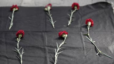 Carnations are seen placed on the ground during a protest against explosions at a peace march in Ankara, in central Istanbul. (Reuters)