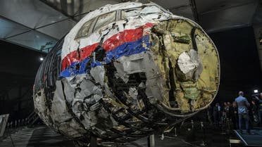 The reconstructed wreckage of the MH17 airplane is seen after the presentation of the final report into the crash of July 2014 of Malaysia Airlines flight MH17 over Ukraine, in Gilze Rijen, the Netherlands, October 13, 2015. Malaysian Airlines Flight 17 was shot down over eastern Ukraine by a Russian-made Buk missile, the Dutch Safety Board said on Tuesday in its final report on the July 2014 crash that killed all 298 aboard. The long-awaited findings of the board, which was not empowered to address questions of responsibility, did not specify who launched the missile. REUTERS/Michael Kooren 
