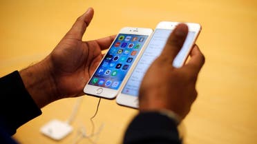 A customer tries out new Apple iPhone 6S at an Apple store on Chicago's Magnificent Mile. (AP)