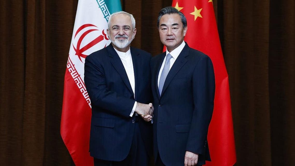 Chinese Foreign Minister Wang Yi, right, and Iranian Foreign Minister Mohammad Javad Zarif pose for photos before a bilateral meeting Tuesday, Sept. 15, 2015 in Beijing, China. ap