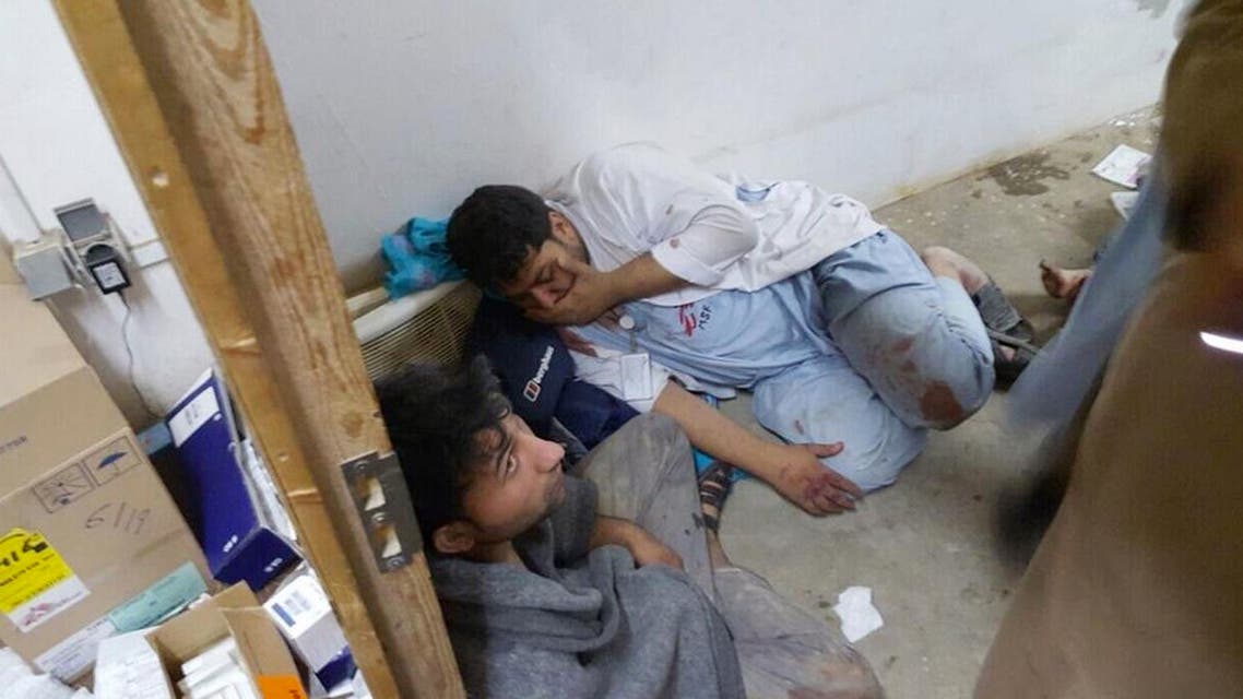 Injured Doctors Without Borders staff are seen near their hospital after it was hit by a U.S. air strike. (AP)