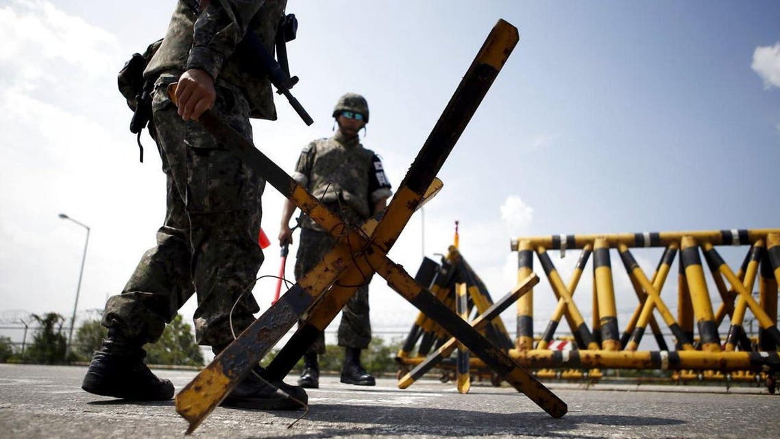 South Korean soldiers set up barricades at a checkpoint on the Grand Unification Bridge which leads to the truce village Panmunjom, just south of the demilitarised zone separating the two Koreas, in Paju, South Korea, August 22, 2015. (Reuters)