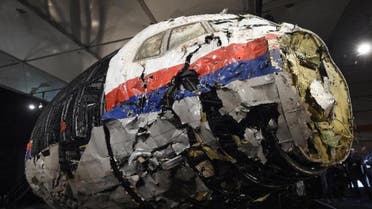 The wrecked cockipt of the Malaysia Airlines MH17 plane that was shot down in Ukraine, killing 298 people, is shown to reporters on October 13, 2015 (AFP)