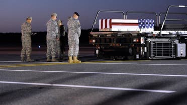 A transfer case containing the remains of Army Spc. Kyle E. Gilbert sits on a loader during a prayer at Dover Air Force Base, Del., Wednesday, Sept. 23, 2015. (AP)