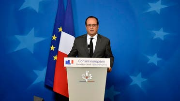 French President Francois Hollande talks to the media at a press conference after the EU summit in Brussels, Belgium on early Friday, Oct. 16, 2015. (AP)