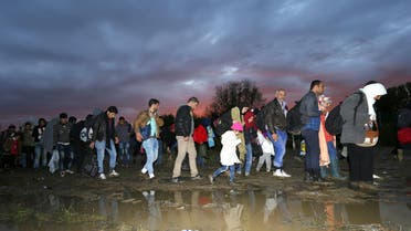 Migrants make their way after crossing the border at Zakany, Hungary October 16, 2015. (Reuters)