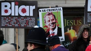 Protesters demonstrate against former British Prime Minister Tony Blair outside the venue where the Iraq inquiry is being held, in central London, Friday, Jan. 21, 2011 AP