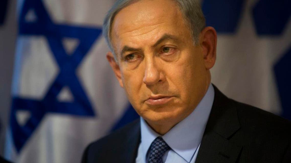 Israeli Prime Minister Benjamin Netanyahu looks on during a press conference at the Foreign Ministry in Jerusalem, Thursday, Oct. 15, 2015. Netanyahu on Thursday said he would be "perfectly open" to meeting with Palestinian President Mahmoud Abbas in order to end weeks of Israeli-Palestinian unrest. (AP Photo/Sebastian Scheiner)