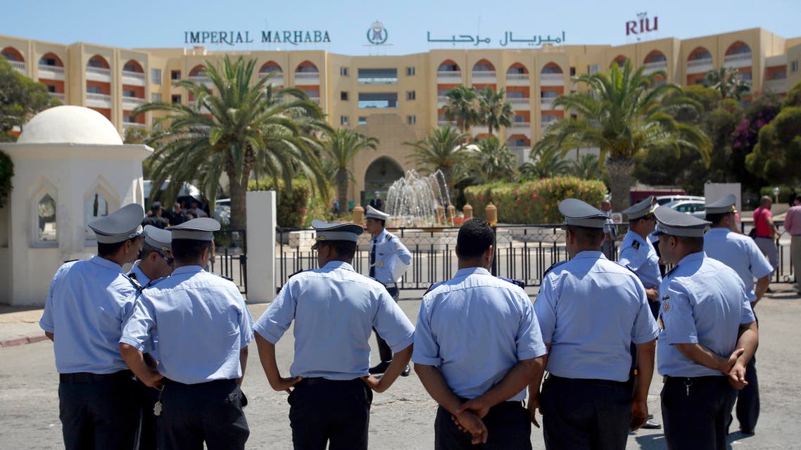 FILE - This Monday, June 29, 2015 file picture shows Tunisian police officers guarding Imperial Marhaba hotel during visit of top security officials of Britain, France, Germany and Belgium in Sousse, Tunisia. Spanish company RIU, which operated the Imperial Marhaba Hotel targeted in a deadly attack on the resort of Sousse in June, said Monday that it is in talks with owners of the 9 properties it currently operates in Tunisia about their future. The head of the Tunisian Hotel Federation, Radhouane Ben Salah, told the Associated Press that RIU’s decision was prompted by difficulty in marketing Tunisia as a tourist destination after the attacks, and that the hotels would close by Sept. 30. (AP Photo/Darko Vojinovic, File)