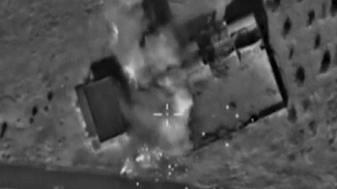 A frame grab taken from footage released by Russia's Defense Ministry Oct.  11, 2015, shows what Russia says is smoke rising after air strikes carried out by the Russian air force on locations controlled by ISIS in Hama province, Syria.  (Reuters)  