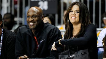 Los Angeles Lakers' Lamar Odom and his wife television personality Khloe Kardashian sit courtside as they attend the 2011  reuters