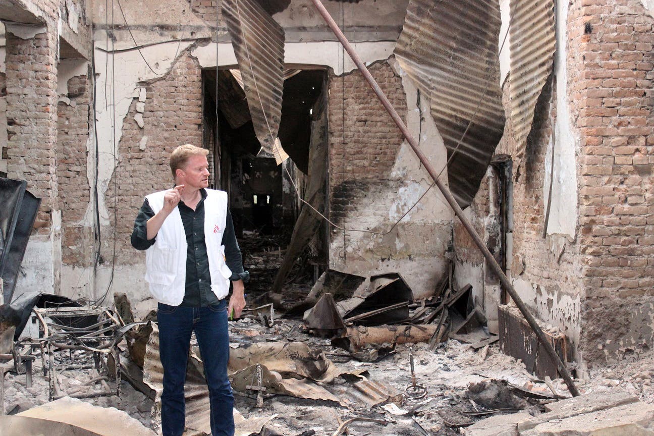 In this Friday, Oct. 16, 2015 photo, Christopher Stokes, the general director of the medical charity, Doctors Without Borders, which is also known by its French abbreviation MSF, stands amid the charred remains of the organization's hospital, after it was hit by a U.S. airstrike in Kunduz, Afghanistan.ap