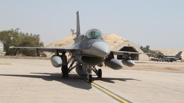 Two of four new U.S.- made F-16 fighter jets stand on the tarmac upon their arrival to Balad air base, 75 kilometers (45 miles) north of Baghdad, Iraq, Monday, July 13, 2015. (AP Photo)