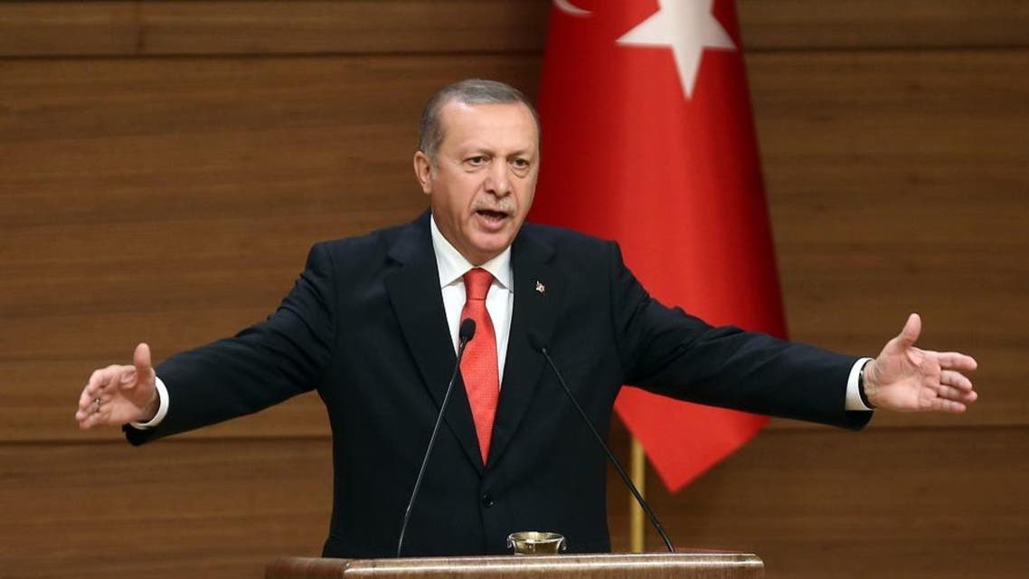 Turkish President Recep Tayyip Erdogan delivers a speech during a meeting with village chiefs at the Presidential Palace in Ankara on October 19, 2015. AFP PHOTO / ADEM ALTAN