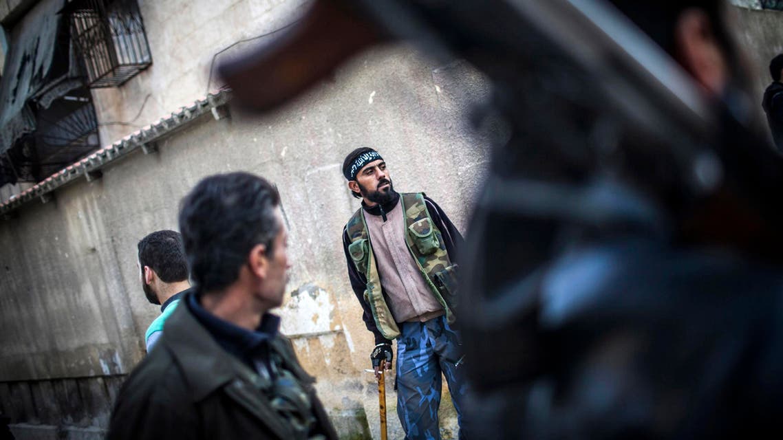 In this Jan. 3, 2013 file photo, Free Syrian Army fighters take a break from the front line in Aleppo, Syria. (AP)