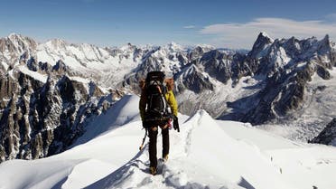  In this file photo taken on Oct. 12, 2011, an alpinist heads down a ridge on the Aiguille du Midi. (AP)