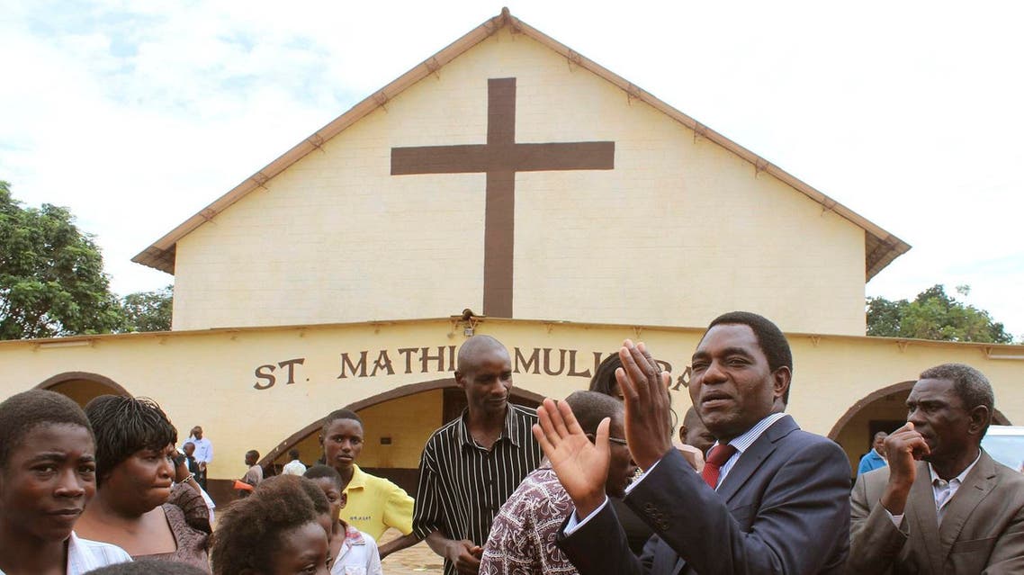 Zambia’s leading opposition United Party for National Development (UPND) leader Hakainde Hichilema, second right, addresses supporters after a church service in Lusaka. (File photo: AP)