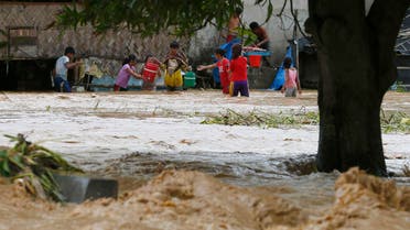 Trapped residents carry their household items as they evacuate to safer grounds amidst raging floodwaters brought about by Typhoon Koppu at Zaragosa township, Nueva Ecija province, north of Manila, Philippines Monday, Oct. 19, 2015. ap