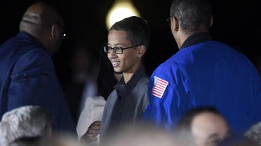 Ahmed Mohamed, center, the Texas teenager arrested after a homemade clock he brought to school was mistaken for a bomb, attends the second-ever White House Astronomy Night on the South Lawn of the White House in Washington, Monday, Oct. 19, 2015.