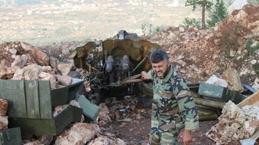  In this photo taken on Saturday, Oct. 10, 2015, a Syrian army soldier fires a cannon in Latakia province, about 12 from the border with Turkey in Syria. Backed by Russian airstrikes, the Syrian army has launched an offensive in central and northwestern regions. (Alexander Kots/Komsomolskaya Pravda via AP)