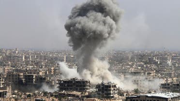  In this photo taken on Wednesday, Oct. 14, 2015, smoke rises after shelling by the Syrian army in Jobar, Damascus, Syria. Backed by Russian airstrikes, the Syrian army has launched an offensive in central and northwestern regions. (Alexander Kots/Komsomolskaya Pravda via AP) RUSSIA OUT
