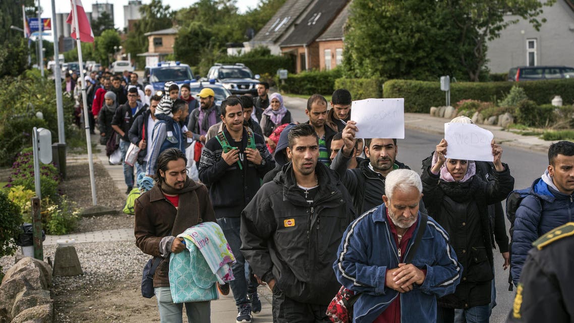 Middle Eastern migrants, who came from Germany by ferry and train Sunday night, and are walking from Rodby in southern Denmark towards Sweden on Monday Sept. 7, 2015. Most of the migrants came from Syria, and wished to continue to Sweden where they will seek asylum. The distance from Rodby to the Oresundsbron in Sweden is 180 kilometres. (AP Photo/POLFOTO, Per Rasmussen) DENMARK OUT