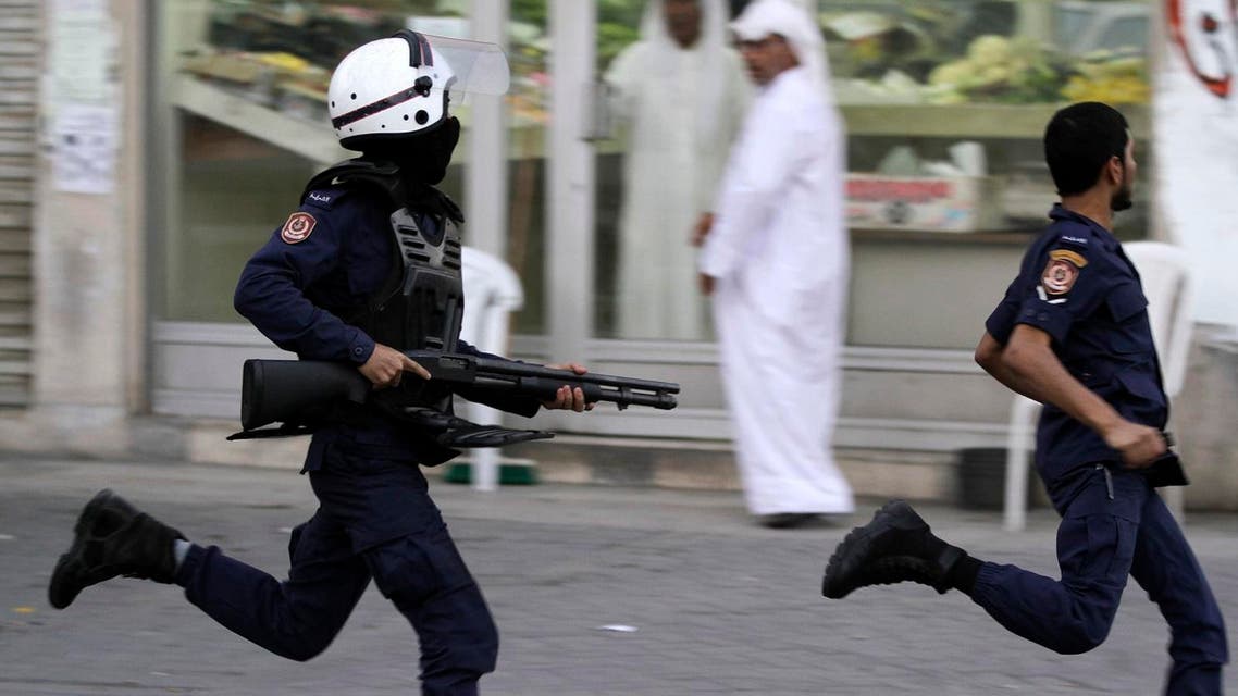 Riot police chase Bahraini anti-government protesters during a demonstration in Malkiya. (File photo: AP)