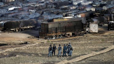 Afghan policemen stand at the site of burning fuel trucks after an overnight attack by the Taliban on the outskirts of Kabul, in this July 5, 2014. (File photo: Reuters)
