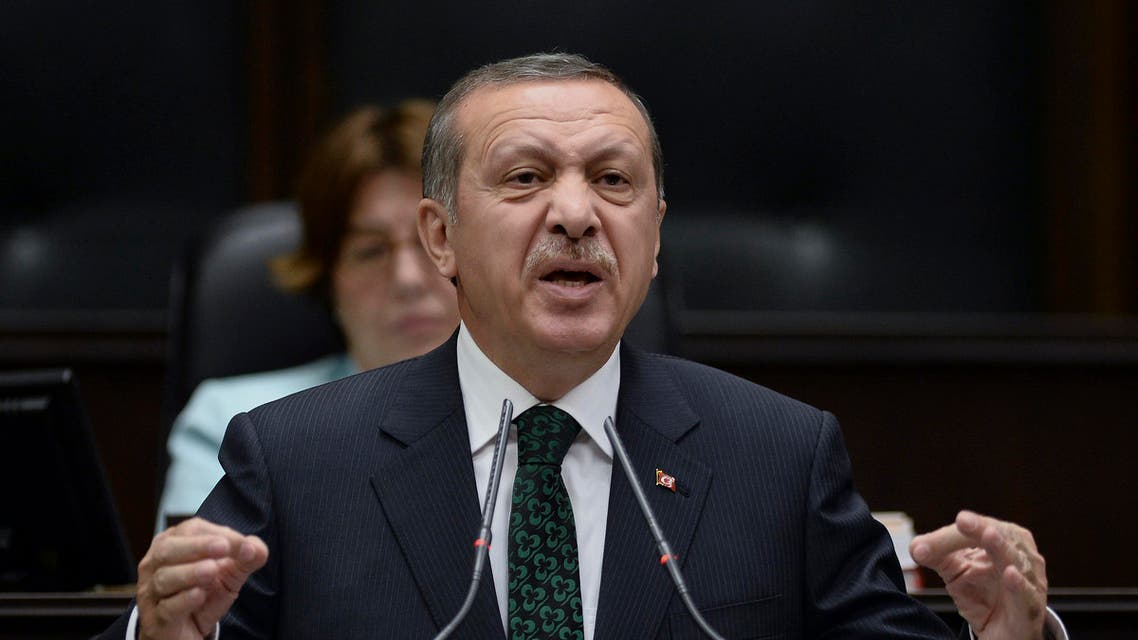 Turkey's Prime Minister Recep Tayyip Erdogan addresses lawmakers and supporters of his ruling Justice and Development Party at the parliament in Ankara, Turkey, Tuesday, June 11, 2013. A peaceful public demonstration against the redevelopment of a city park has changed into clashes between protesters and police in a test of Prime Minister Erdogan’s authority, and as clashes continue Tuesday, Erdogan made it more than clear that he had come to the end of his tolerance.(AP Photo)