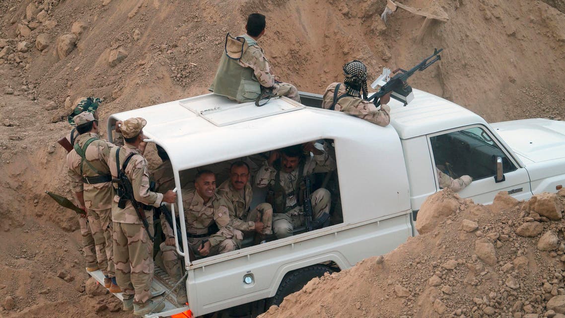 Kurdish troops known as peshmerga prepare to attack Islamic State group positions during a military operation to regain control of some villages west of the oil-rich city of Kirkuk, 180 miles (290 kilometers) north of Baghdad, Iraq, Wednesday, Sept. 30, 2015. Kurdish fighters in northern Iraq drove the IS group from more than 140 sq. kilometers (54 sq. miles) of territory near Kirkuk and cleared part of a major highway on Wednesday. (AP Photo)