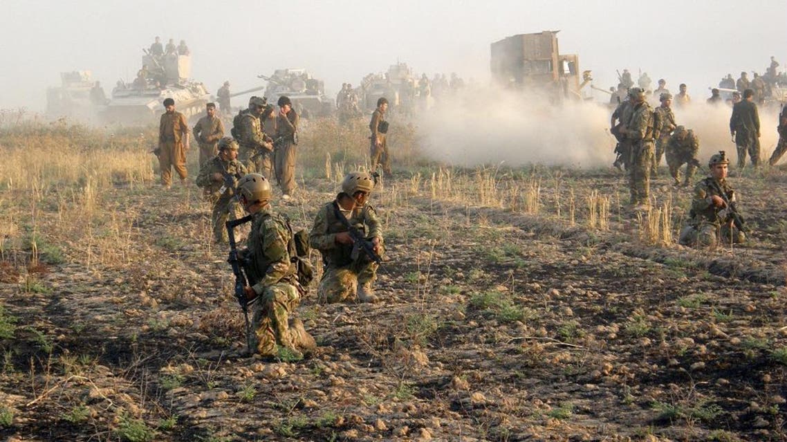 Kurdish troops known as peshmerga deploy during a military operation to regain control of some villages from Islamic State group fighters south of oil-rich city of Kirkuk, 180 miles (290 kilometers) north of Baghdad, Iraq, Wednesday, Aug. 26, 2015. (AP Photo)