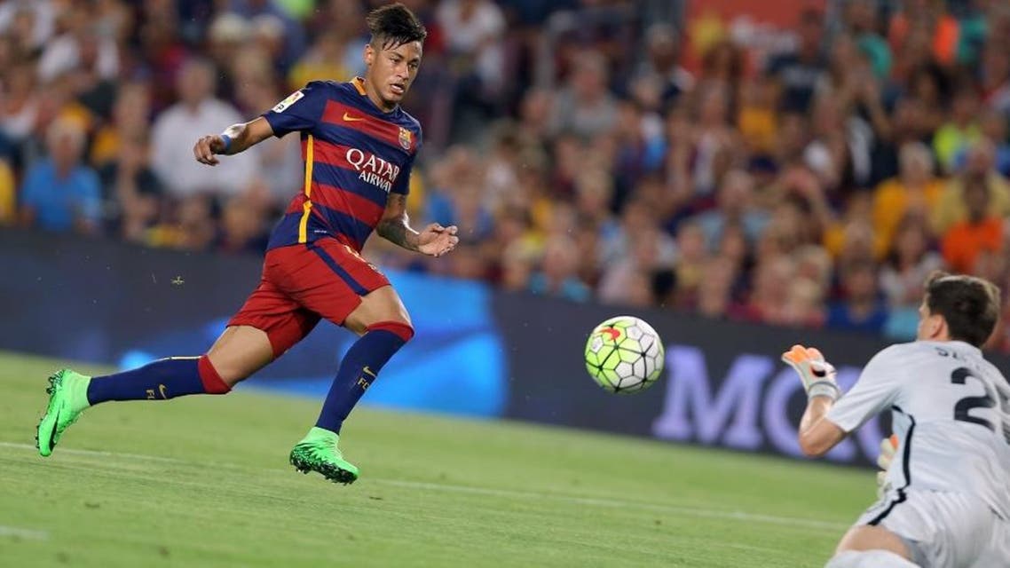 Barcelona's Neymar, left, challenges Roma goalkeeper Szczesny during the Joan Gamper trophy soccer match between FC Barcelona and AS Roma at the Camp Nou stadium in Barcelona, Spain, Wednesday, Aug. 5, 2015. (AP
