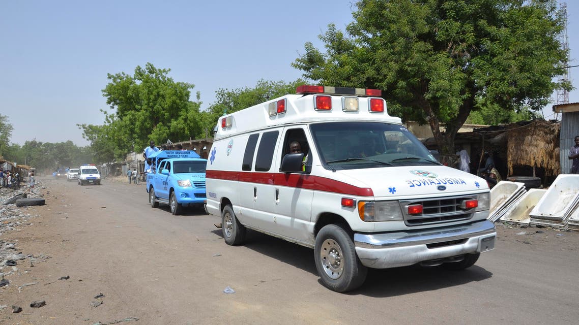 An ambulance and security cars drive to the site of a suicide bomb attack at a market in Maiduguri, Nigeria, Tuesday, June 2, 2015. AP