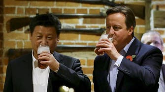 Raising a pint, Xi and Cameron toast ‘golden’ ties over fish and chips