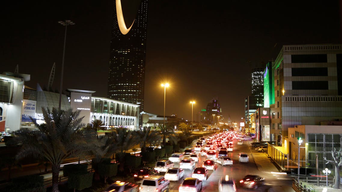 Cars pass by the kingdom tower Sunday, June 14, 2015, in Riyadh, Saudi Arabia. (AP)