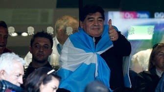 With a blow of a kiss, Maradona roars on Argentina