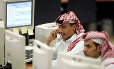 Saudi office workers monitor the stock market at a bank in Riyadh. (File photo: Reuters)