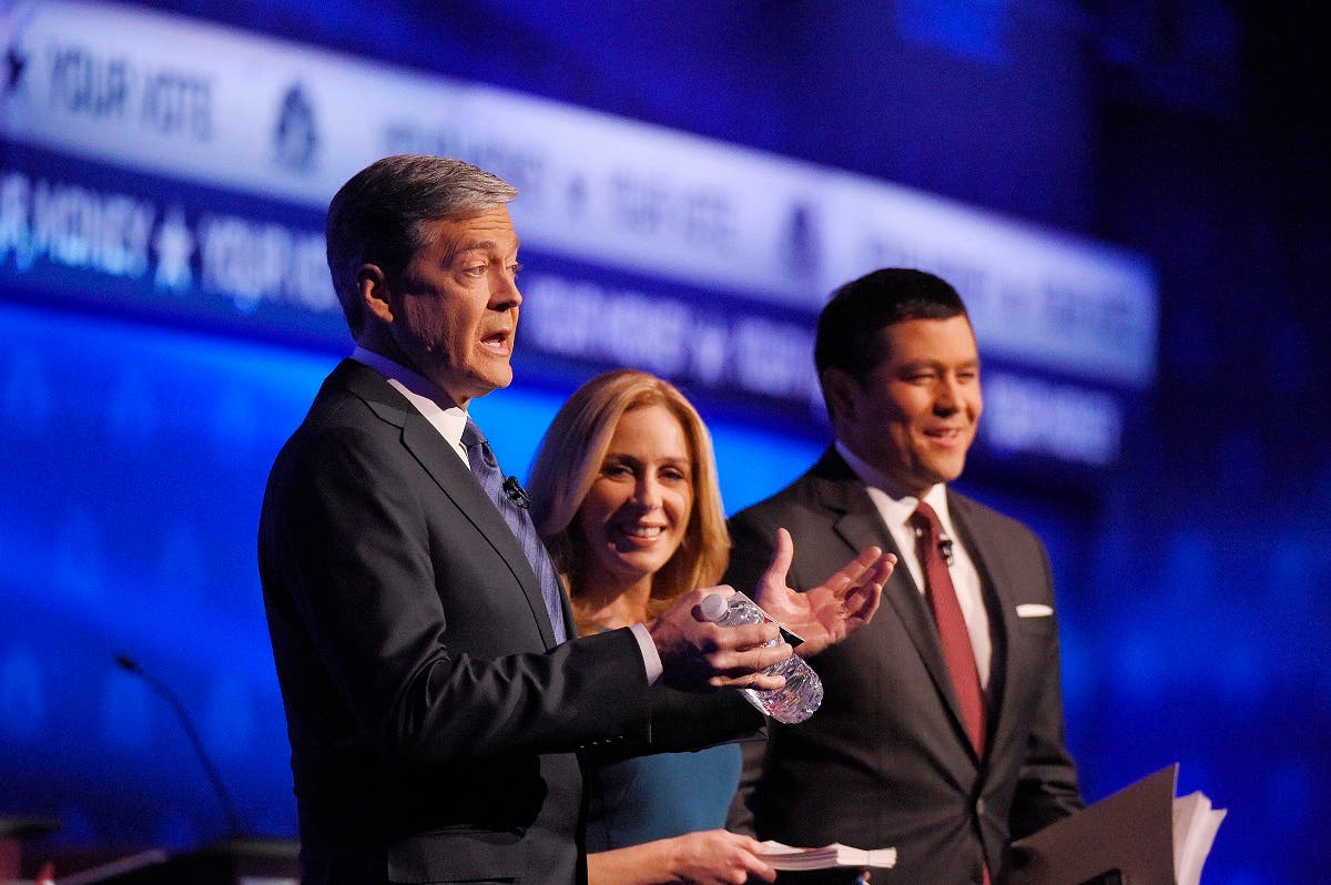 Debate moderators John Harwood, left, Becky Quick, center, and Carl Quintanilla take the stage during the CNBC Republican presidential debate at the University of Colorado. (AP)