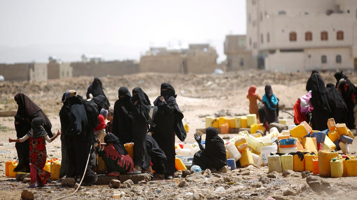 Women and children fill buckets with water from a public tap amid an acute shortage of water, on the outskirts of Sanaa, Yemen, Tuesday, Oct. 13, 2015. (AP)