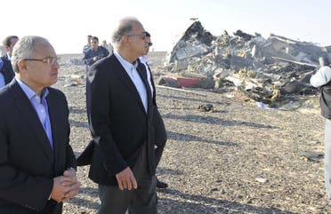 Egypt's Prime Minister Sherif Ismail (2nd L) and Tourism Minister Hisham Zaazou look at the remains of a Russian airliner which crashed in central Sinai near El Arish city, north Egypt, October 31, 2015. The Airbus A321, operated by Russian airline Kogalymavia under the brand name Metrojet, carrying 224 passengers crashed into a mountainous area of Egypt's Sinai peninsula on Saturday shortly after losing radar contact near cruising altitude, killing all aboard. REUTERS/Stringer TPX IMAGES OF THE DAY