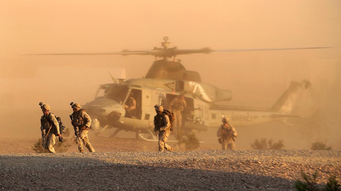 A Marine Corps UN-1Y Huey helicopter inserts Marines during a raid exercise on K-9 Village, Yuma Proving Ground, Ariz., Oct. 1, 2014. (Photo courtesy of U.S. Marines)