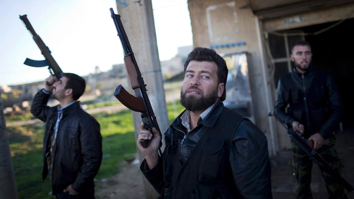 FILE - In this Tuesday, Dec. 11, 2012 file photo, Free Syrian Army fighters look at a Syrian Army jet, not pictured, in Fafeen village, north of Aleppo province, Syria. When Russian Foreign Minister Sergey Lavrov said his country is ready to aid Syrian rebels fighting Islamic State militants on the ground, rebel commanders scoffed at the notion, pointing out that Russian aircraft were pounding rebel bases in central and northern Syria on daily basis. (AP Photo/Manu Brabo, File)
