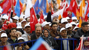 Supporters of the ruling AK Party wave national and party flags during an election rally in Ankara, Turkey, October 31, 2015.