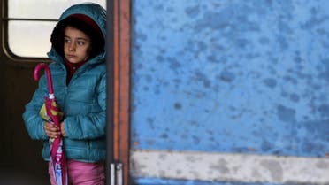 A migrant child stands in a train cabin on arrival near the border with Serbia, at a railway station in Tabanovce. (Reuters)