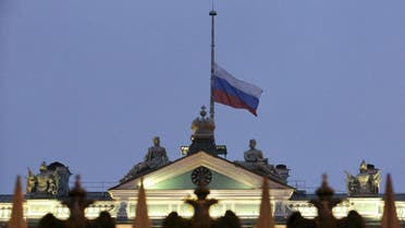 The Russian national flag flies at half-mast on the roof of the State Hermitage Museum in St. Petersburg, Russia November 1, 2015. REU