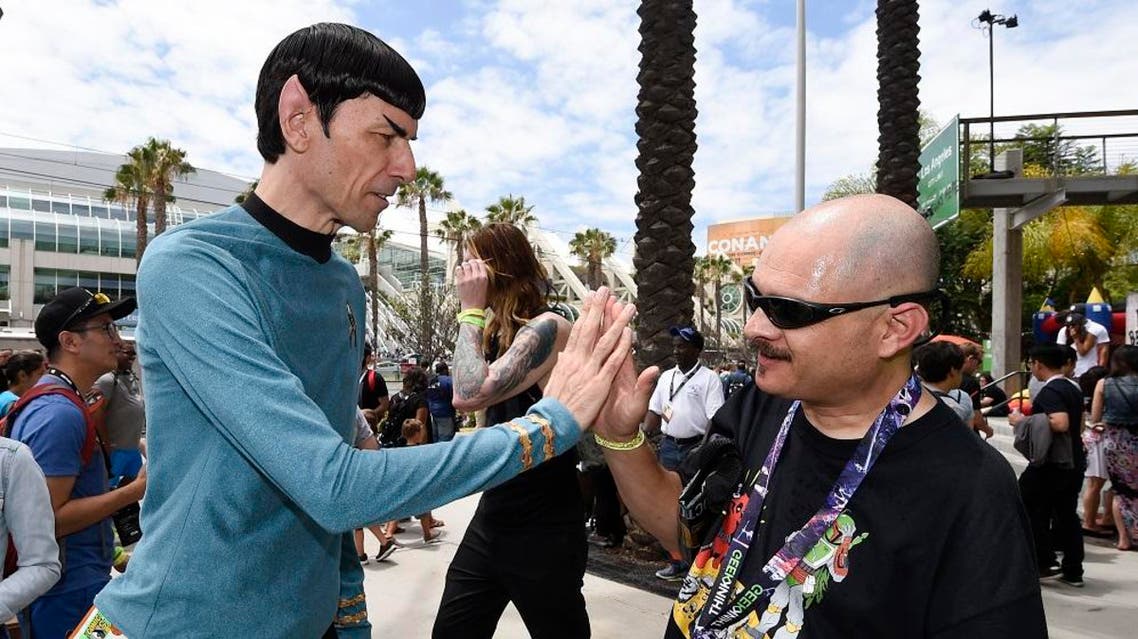 Spock Vegas dressed as Star Trek's Mr. Spock gives the ‘live long and prosper’ high five to a fan at the 2015 Comic-Con International in San Diego. (File: AP)