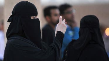 A Saudi woman uses her cellphone in the village of al-Thamama, near Riyadh, Feb. 22, 2014. (AFP)