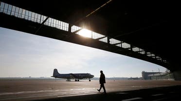 A man walks past a vintage U.S. C-54 aircraft at the former Berlin-Tempelhof airfield in Berlin. (File: Reuters)