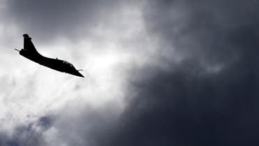 A Rafale fighter jet flies over the factory of French aircraft manufacturer Dassault Aviation in Merignac near Bordeaux during a visit by the French President March 4, 2015. (Reuters)