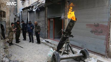 Syrian rebels firing locally made shells against the Syrian government forces, in Aleppo, Syria.  AP